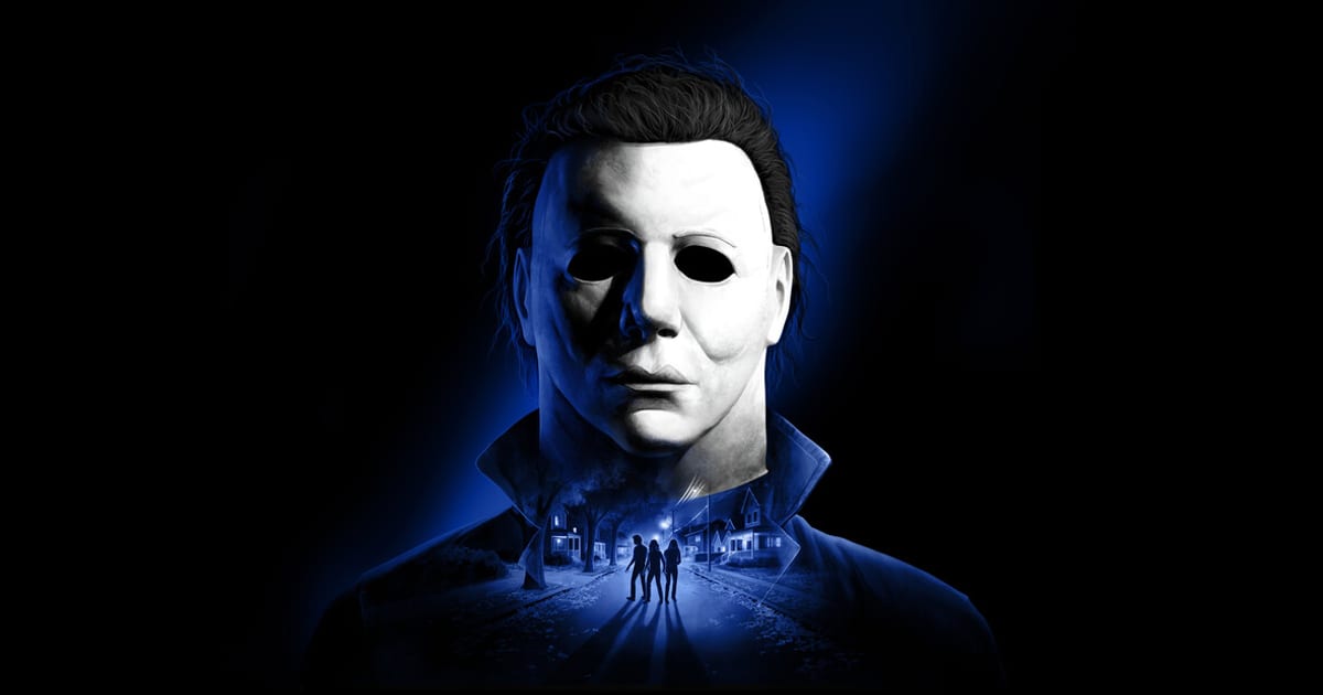 Halloween: The Game key art showing Michael Myers' white mask lit in blue, with three teenagers walking down a Haddonfield street at night reflected in his jacket