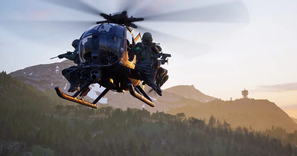 WARDOGS screenshot of a small black helicopter flying low over a forested mountain valley at sunset with soldiers sitting on its side benches, rifles ready